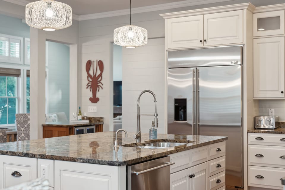 Large kitchen with stainless steel appliances.