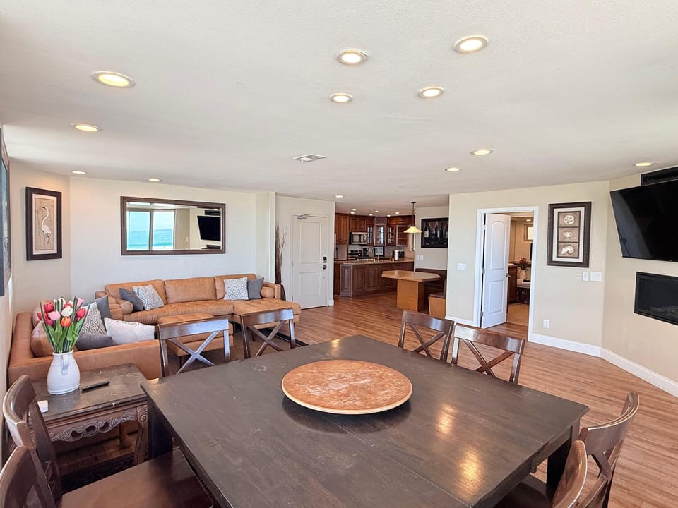 Spacious open-concept living and dining area with cozy seating