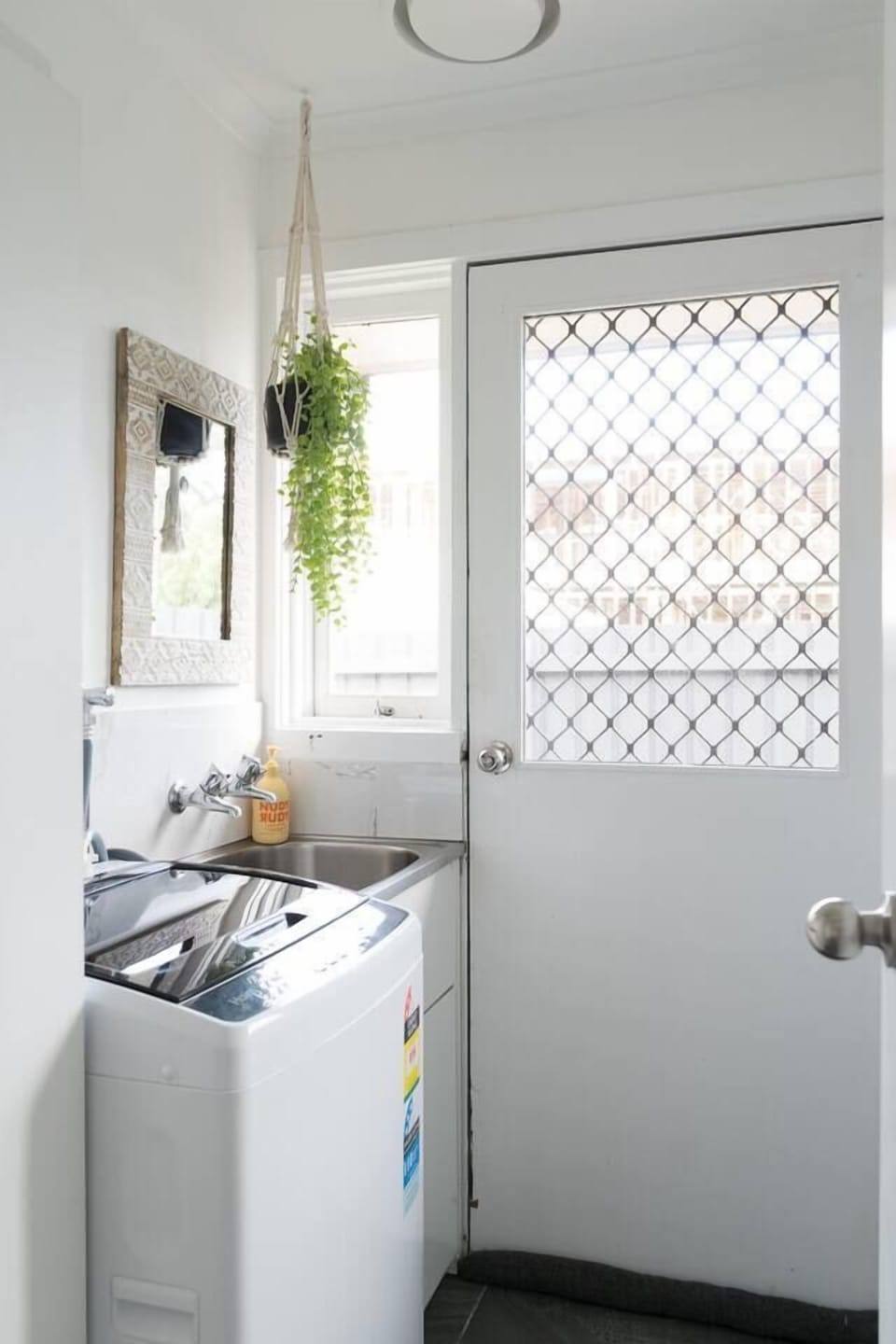 In-unit laundry includes a washing machine and basin, and there's a dryer in the garage. 
