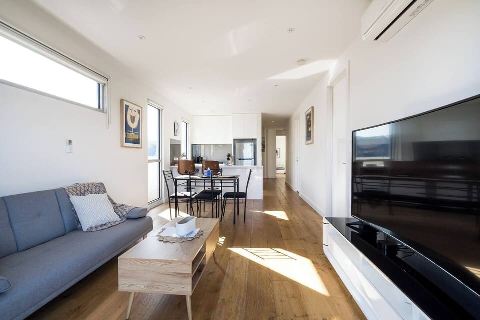 A cosy sofa and TV in the living area offer an inviting space to relax, while split system heating and air conditioning ensure year-round comfort. 
