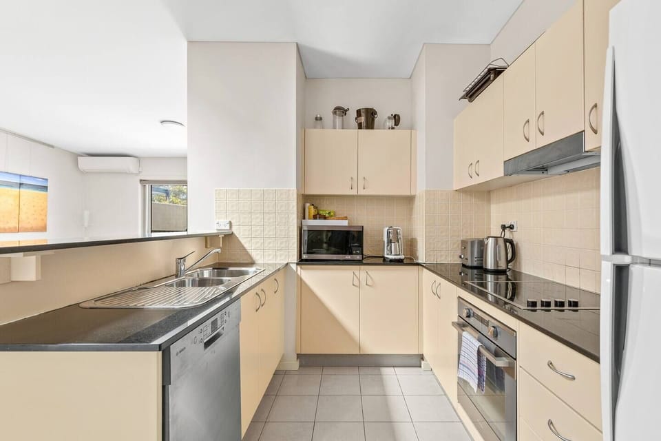 Whip up a home cooked meal in the contemporary kitchen with breakfast bar island and ample benchtop space.