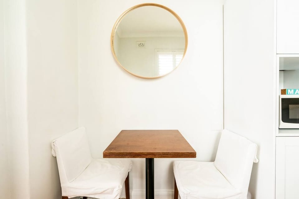 Within the kitchen is a diner-style table for having meals at home.