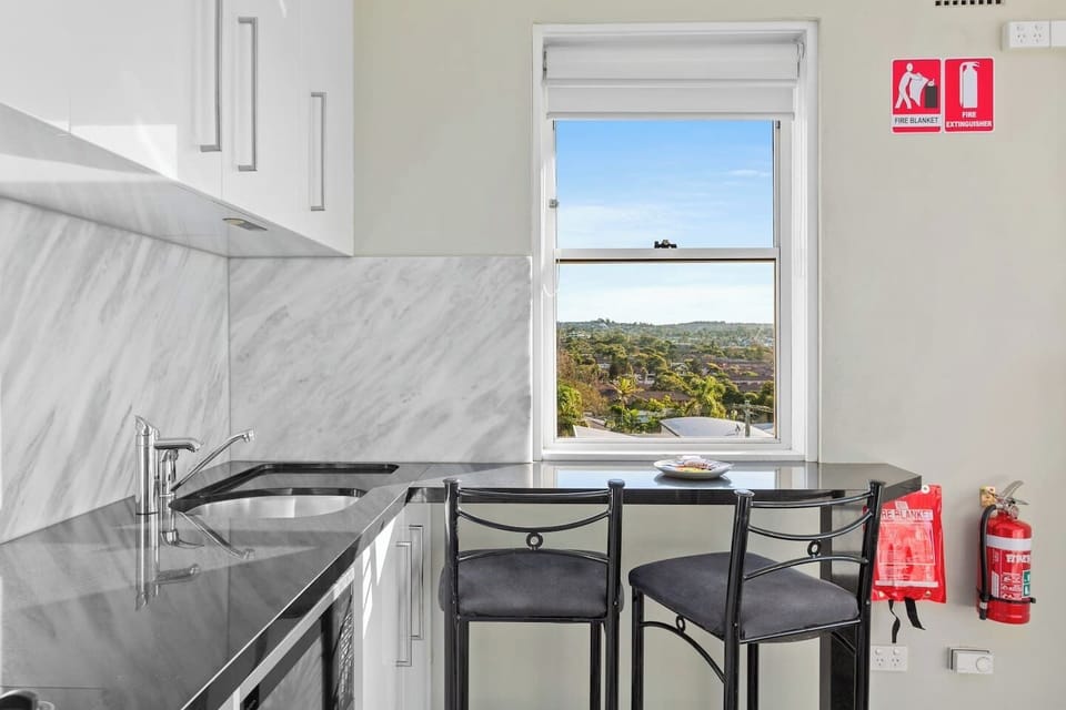 The kitchen provides plenty of storage and ample bench space for meal preparation. 