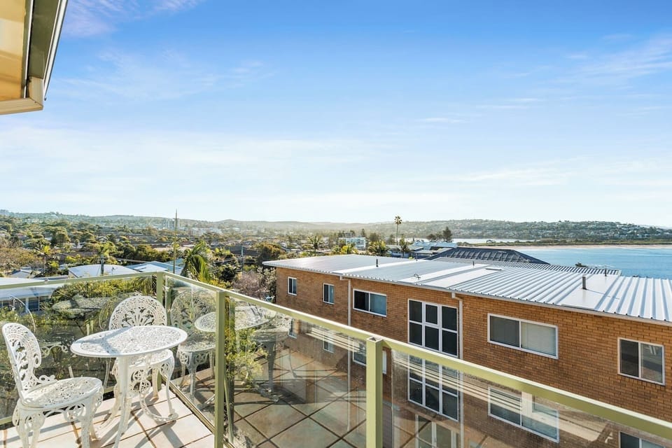 Enjoy the sunny balcony with ocean views. An outdoor sitting area is perfect for enjoying meals outside. 

