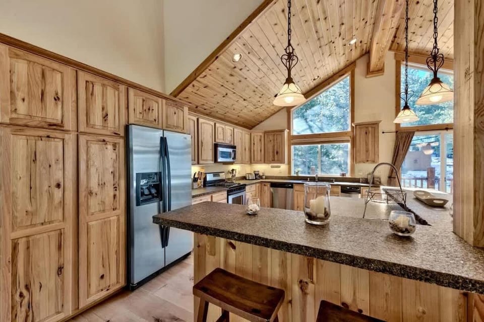 Fully equipped kitchen in a spacious Tahoe Donner vacation rental with gas range, generous counter space and everything needed to prepare meals for large groups.
