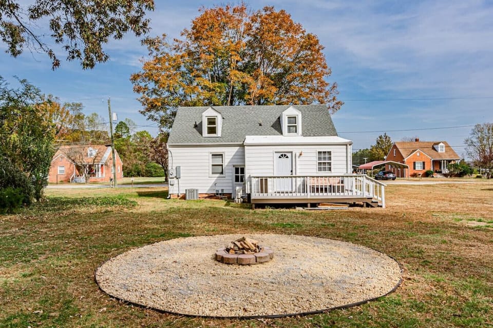 Step outside to a cozy backyard retreat backing up to the woodline, offering privacy and tranquility. Gather around the firepit with loved ones for unforgettable evenings under the stars.
