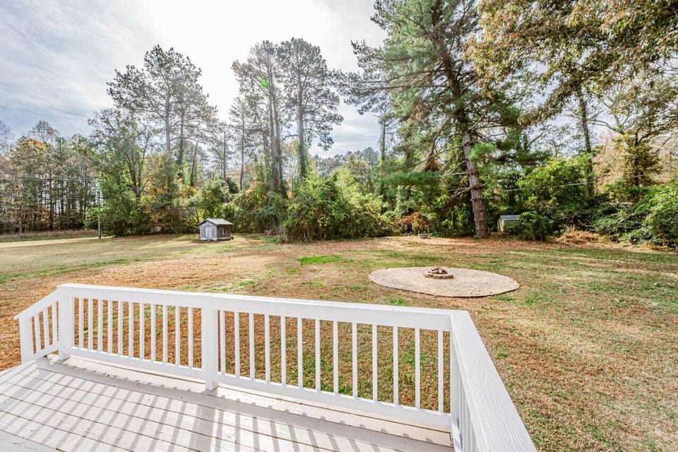 The back patio is the perfect place to unwind, complete with outdoor furniture for morning coffee or evening relaxation.