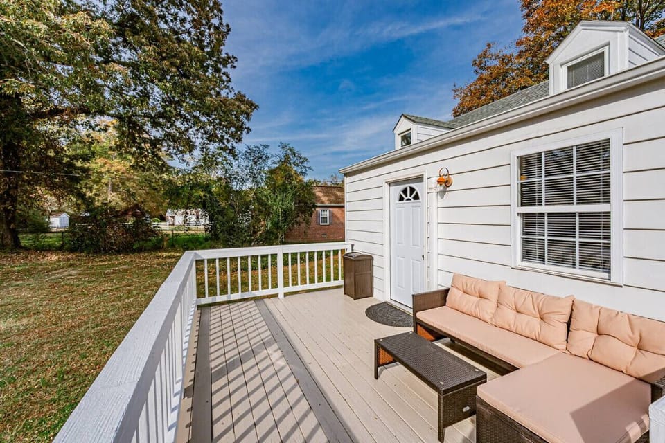 The back patio is the perfect place to unwind, complete with outdoor furniture for morning coffee or evening relaxation.