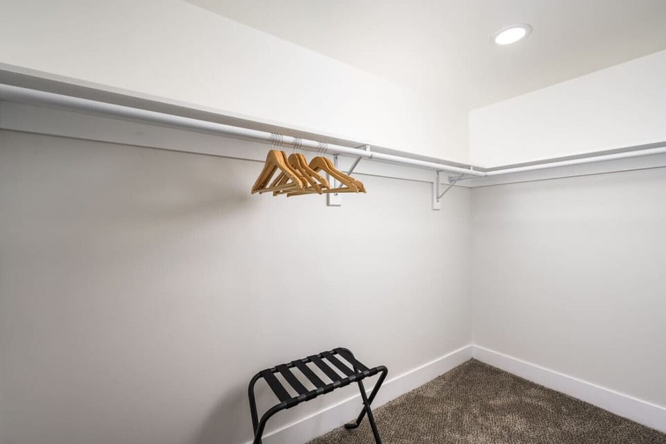 Luggage racks & wood hangers in every bedroom!
