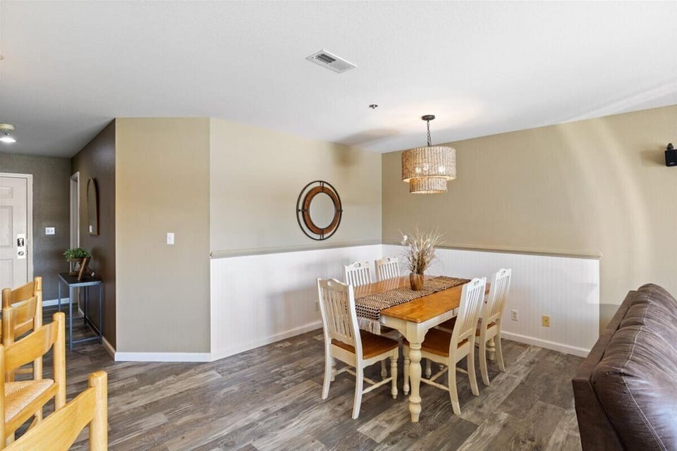 The dedicated dining area provides a table with comfortable seating for six guests.
