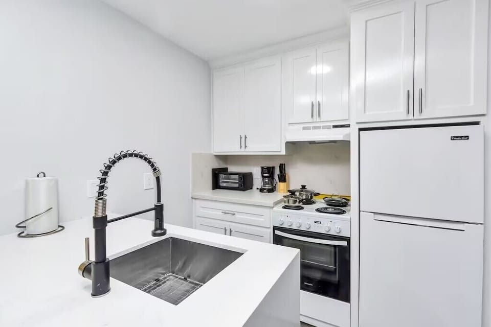 Kitchen with basic amenities and counter top applicances