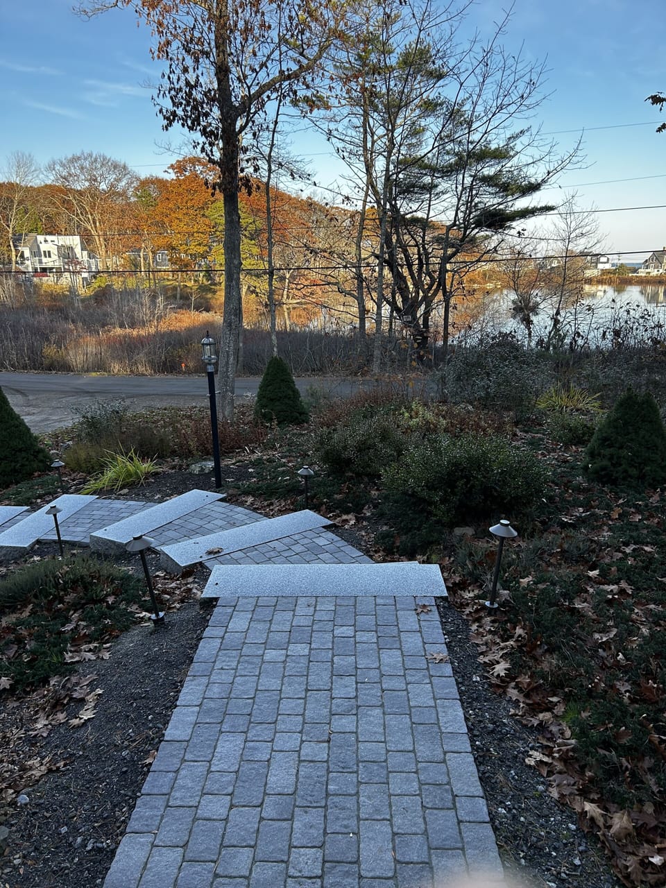 View of front yard plantings and granite steps