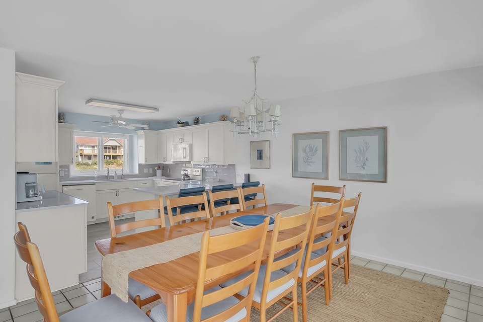 Gather your group around this spacious dining table while the chef prepares meals in the bright, fully-equipped kitchen just steps away.
