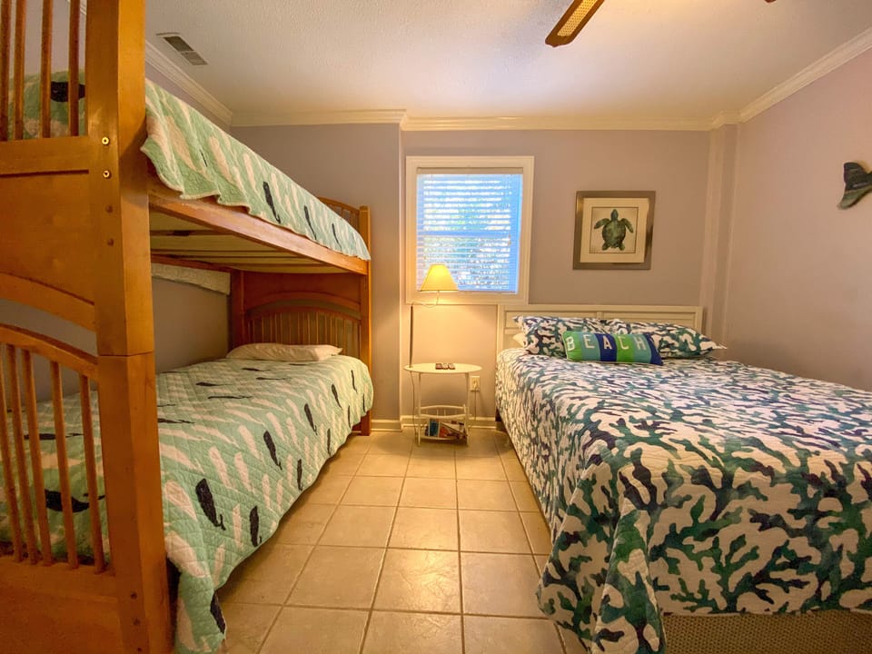 Your ocean-themed bedroom offers comfortable sleeping for the whole family with bunk beds and a cozy queen bed.