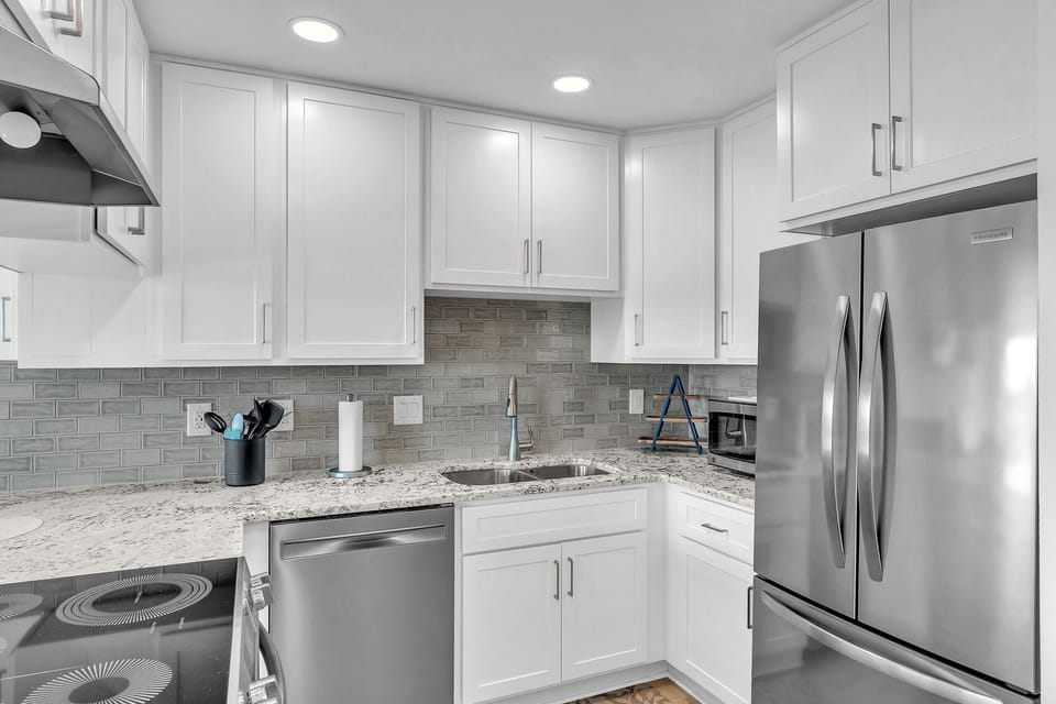 Cook up your favorite meals in this bright, fully equipped kitchen with modern appliances, sleek granite countertops, and plenty of storage space for all your vacation essentials.