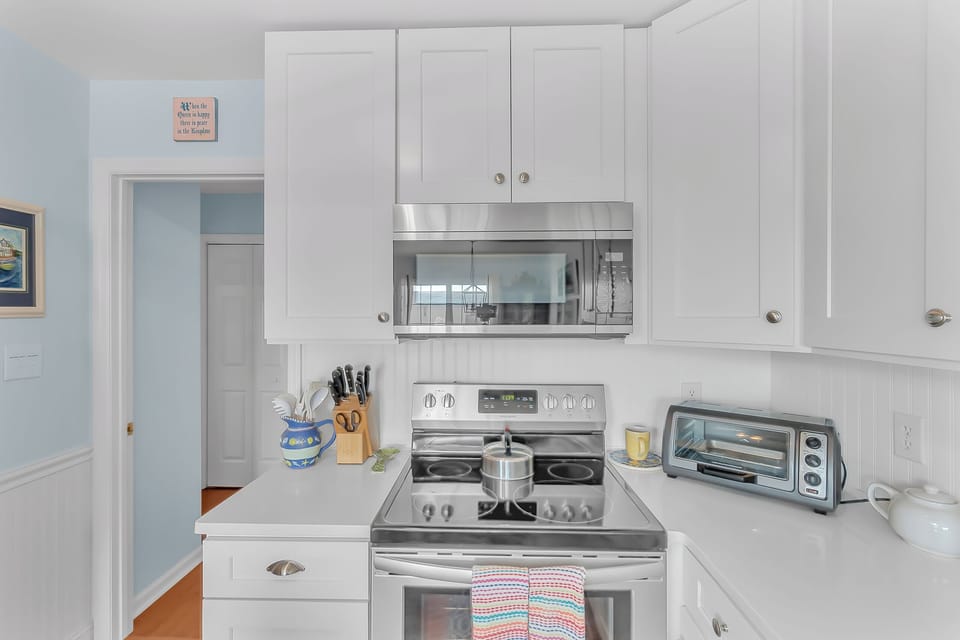 Your fully equipped kitchen awaits with modern appliances and ample storage for all your culinary adventures.