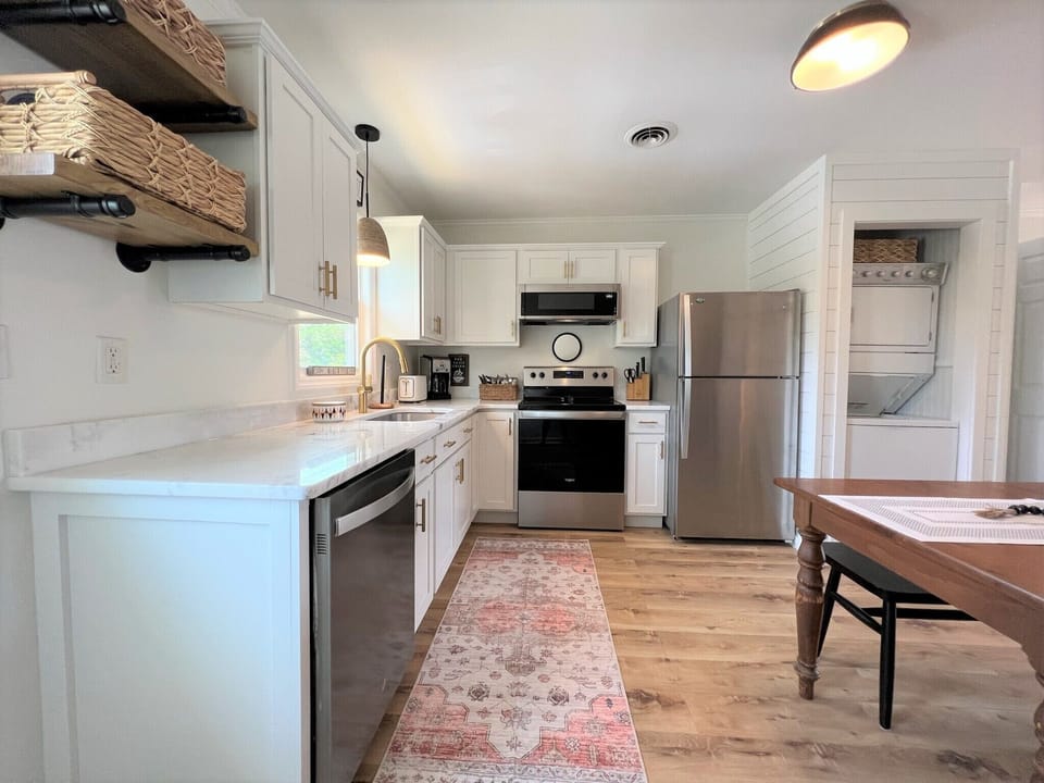 Your fully equipped kitchen invites culinary adventures with gleaming countertops, modern appliances, and thoughtful storage—perfect for preparing memorable meals during your stay.