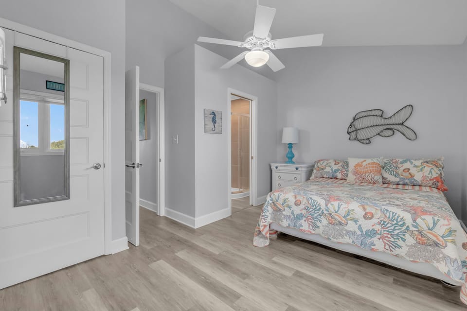 Drift into coastal dreams in your serene bedroom, where ocean-themed linens and charming nautical touches create the perfect seaside sanctuary.