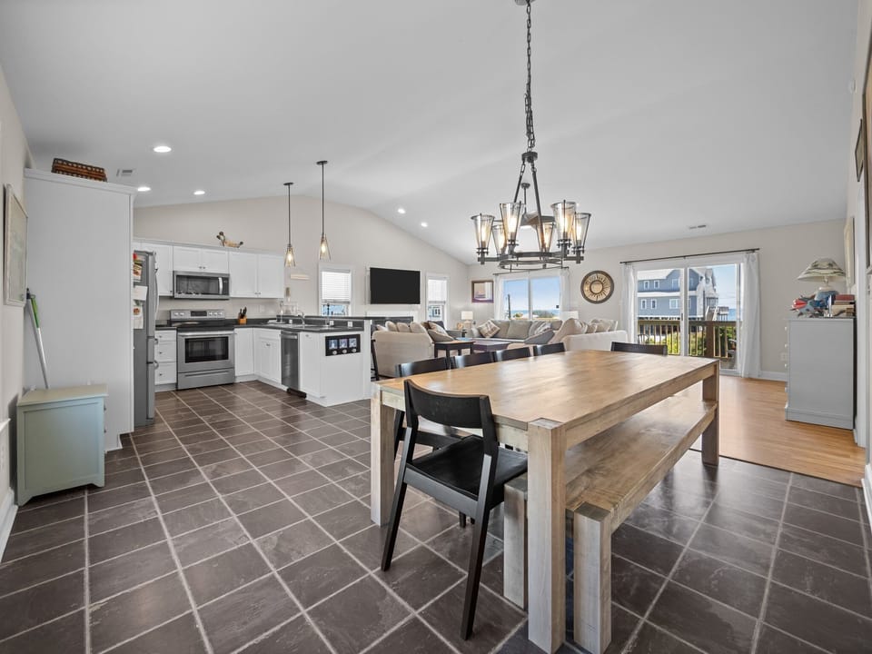 Your spacious open-concept kitchen flows seamlessly into the living area, perfect for gathering with family while preparing meals together.
