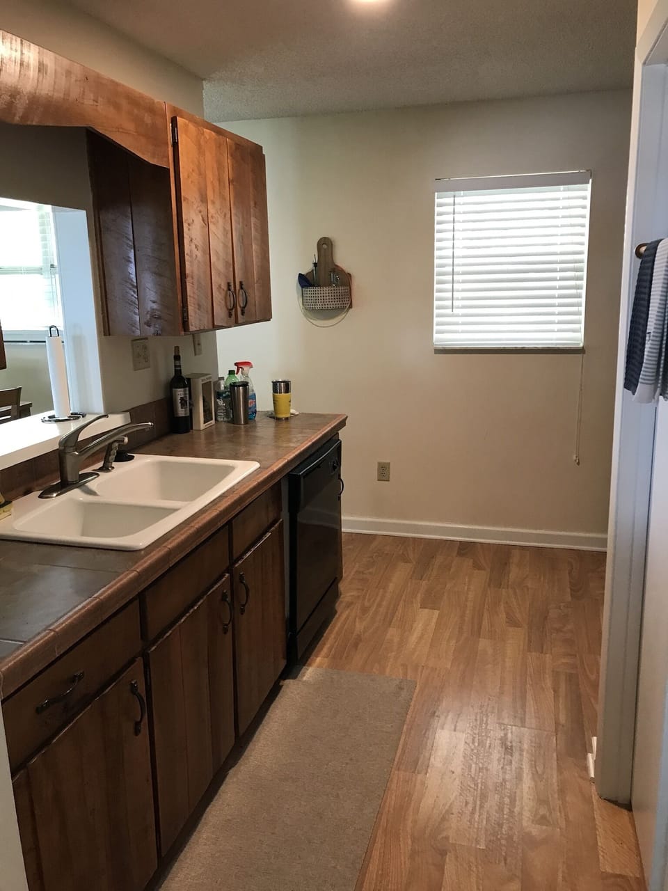 Galley kitchen with door leading to laundry room 