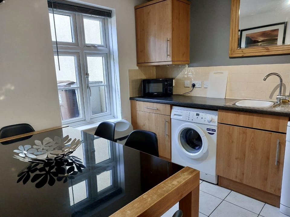 Cosy bright kitchen fully equipped with utilities. 