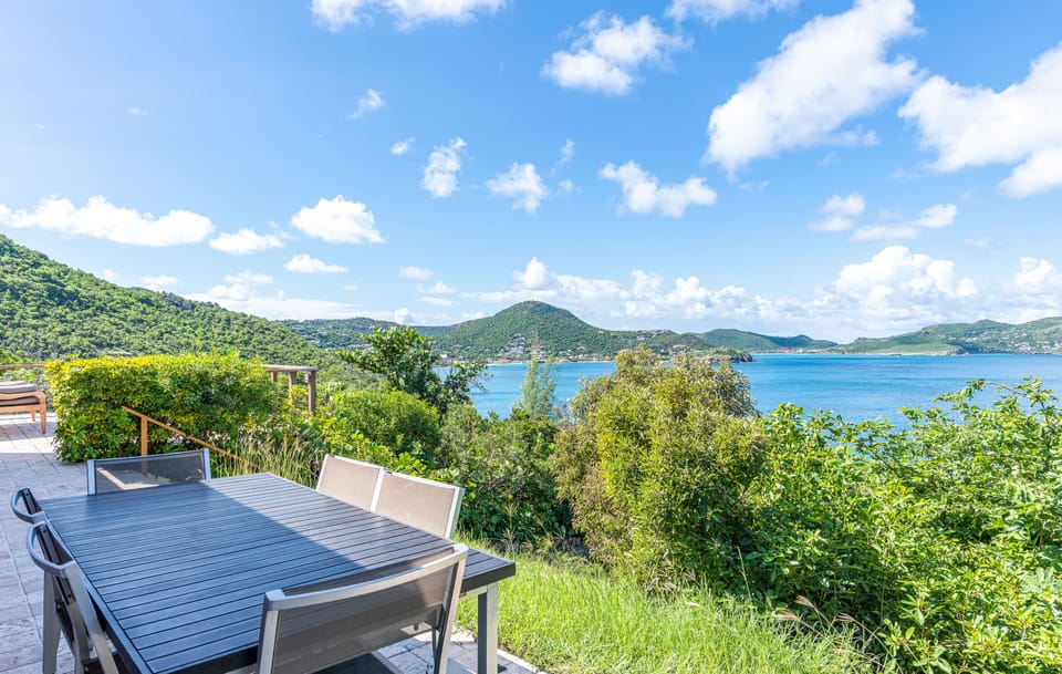 Fully equipped air conditioned kitchen, with electric oven, microwave, fridge and freezer, dishwasher, toaster, coffee machine, blender, electric kettle. Outside dining areas with a rectangular table for 6 guests on the terrace, and a wooden table under t