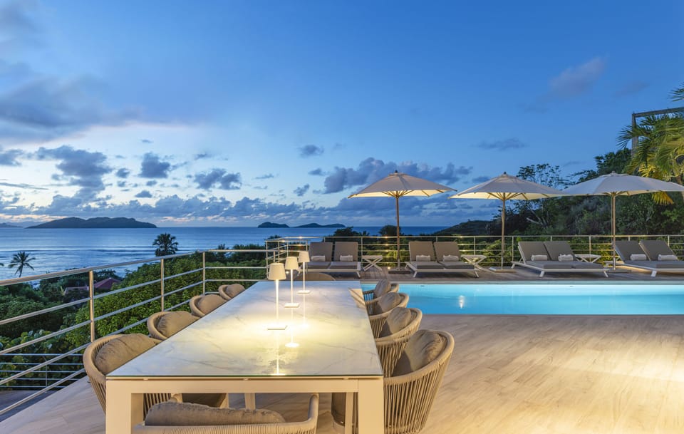 Outdoor dining table for 10 people on the terrace facing the view. 