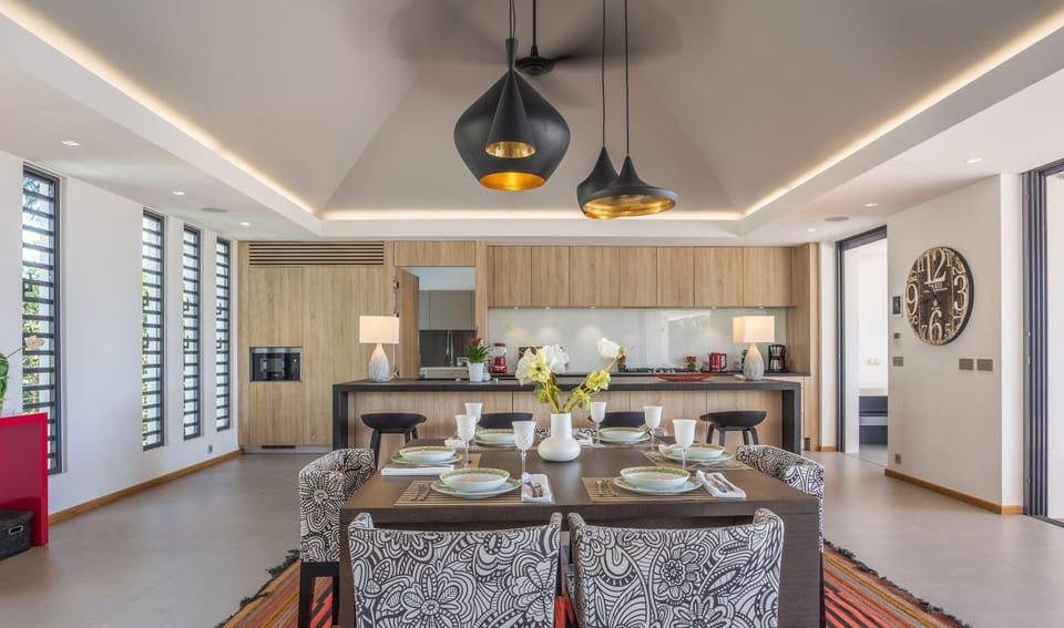 Large indoor dining table for six guests. A second dining area is on the covered terrace, with a dining table for 8 guests. 