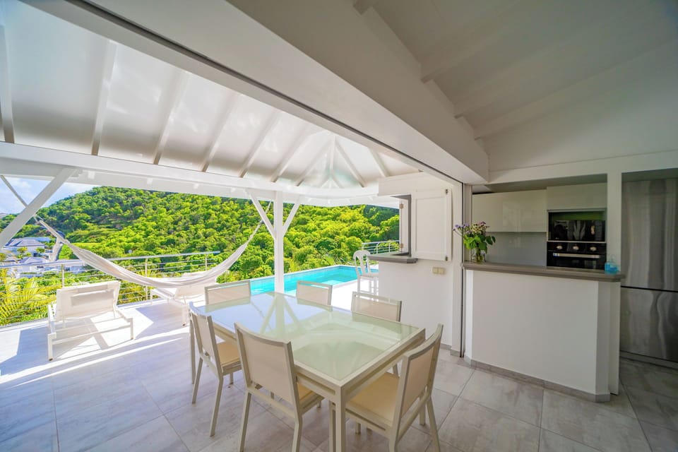 Fully equipped outside kitchenette with electric oven and stove, fridge and freezer, dish washer, microwave, toaster, regular filter coffee machine and Nespresso machine, electric kettle. Large dining table on the covered terrace for 6 guests.