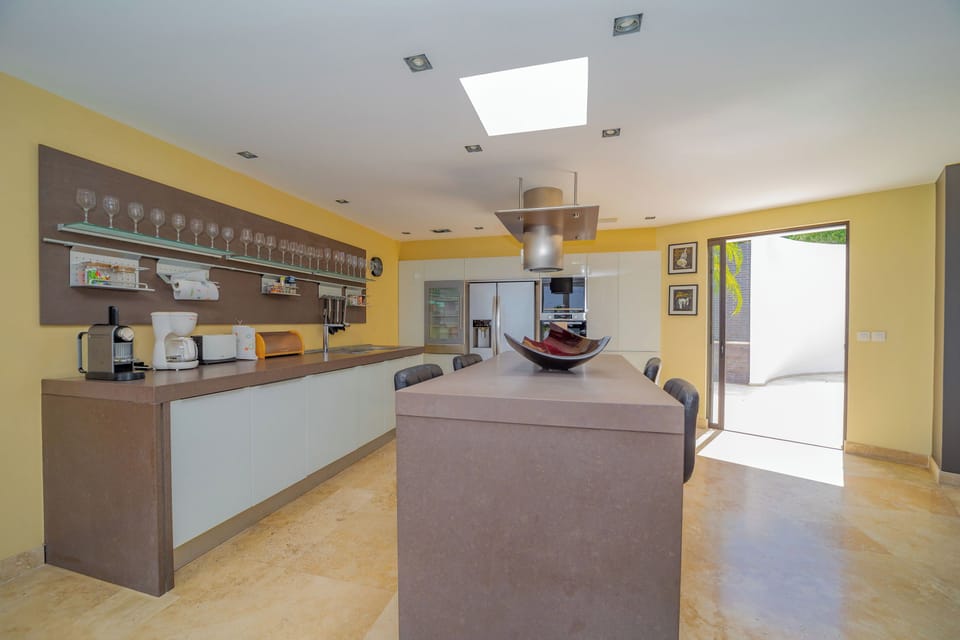 Modern and fully-equipped kitchen with stainless steel appliances, De Dietrich hobs, Siemens oven, ice maker, wine cooler, fridge, freezer, dishwasher, microwave,blender, Nespresso coffee machine, juice maker machine, toaster. 