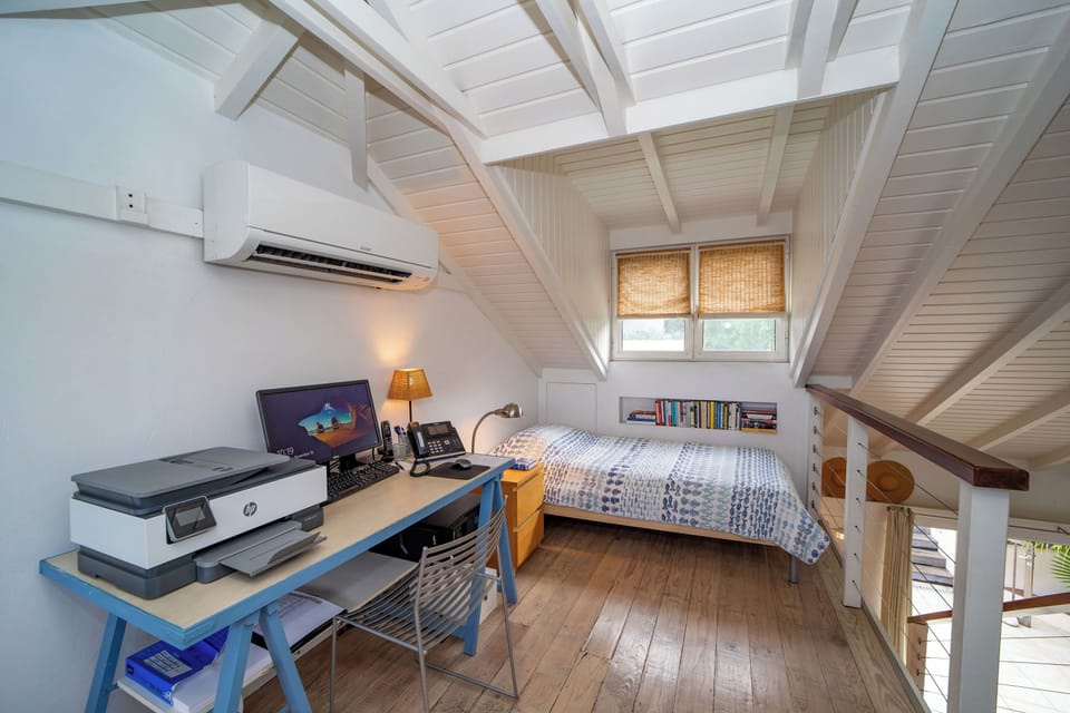 On the upper level. Air conditioning, 2 single beds that can be used as an extra bedroom, with an extra fee of 50$/night.