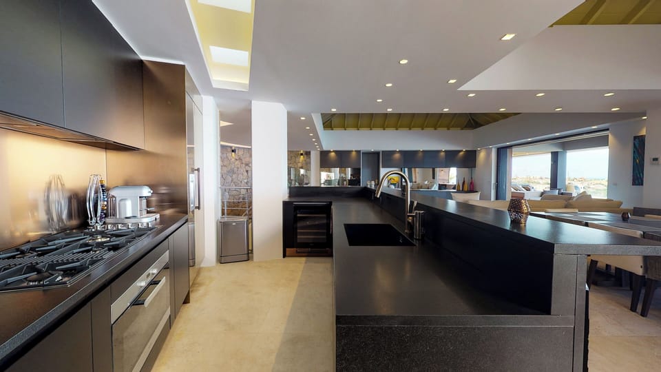 Fully equipped. Electric oven, gas stove, microwave, refrigerator, mixer, centrifuge, freezer, dishwasher, Nespresso machine, blender, kettle, toaster, breakfast bar with stools. Indoor dining area in the great room. Large outdoor dining table on the cove