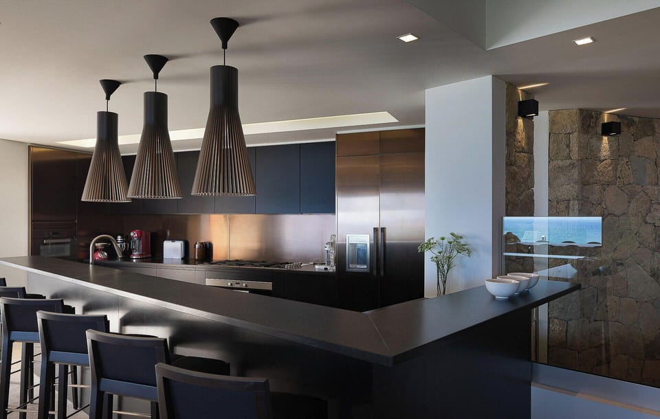 Fully equipped. Electric oven, gas stove, microwave, refrigerator, mixer, centrifuge, freezer, dishwasher, Nespresso machine, blender, kettle, toaster, breakfast bar with stools. Indoor dining area in the great room. Large outdoor dining table on the cove