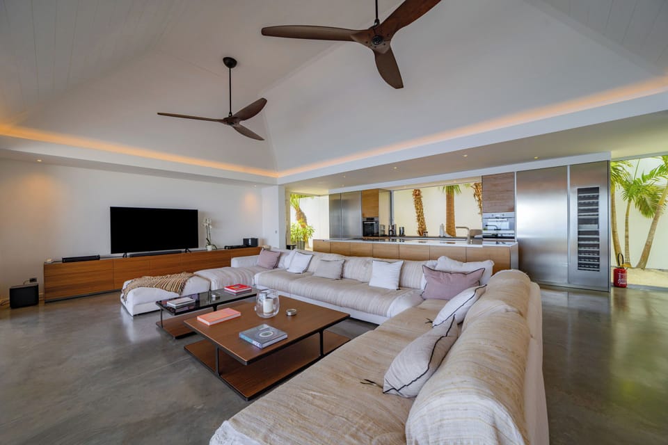 Air conditioning, HD-TV, Dish Network, DVD player, iPod docking station, stereo. The living room opens onto the expansive terrace and the panoramic views. 