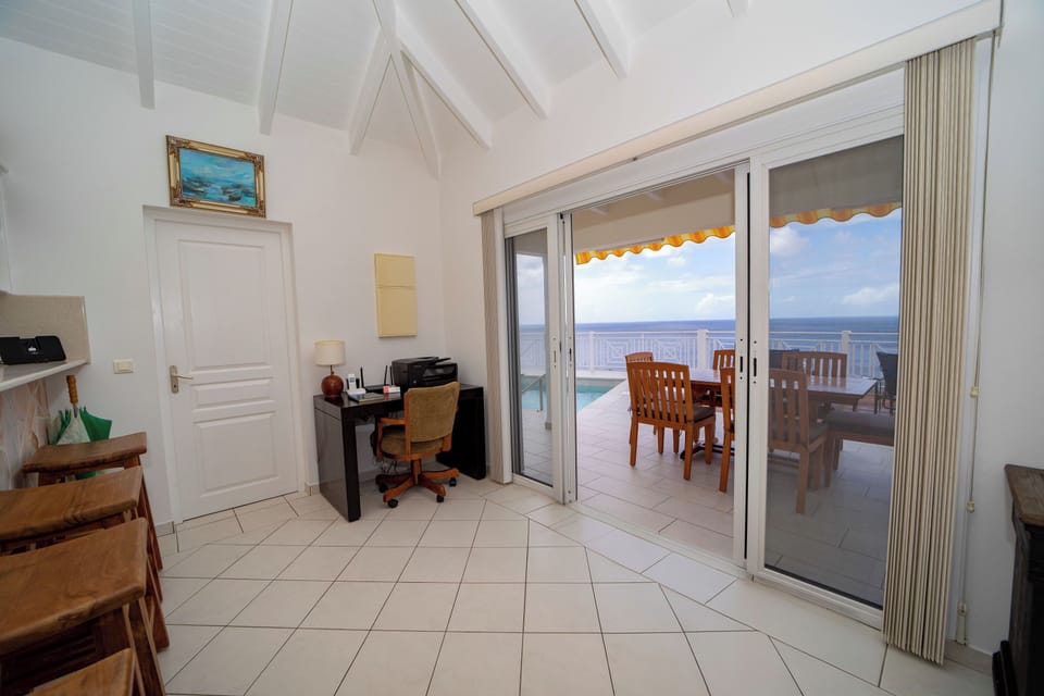 Spacious air-conditioned living room. Ceiling fan, HD-TV, Dish Network. 