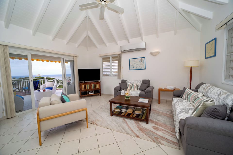 Spacious air-conditioned living room. Ceiling fan, HD-TV, Dish Network. 