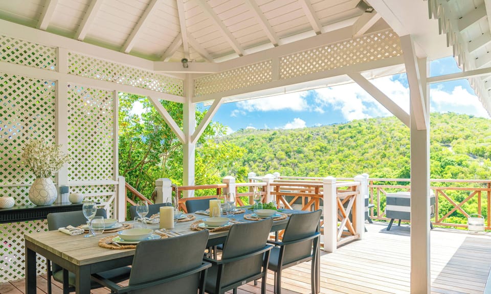 Fully equipped air-conditioned kitchen with electric oven, induction cooker, microwave, fridge and freezer, dishwasher, toaster, coffee maker, blender, electric kettle. Outdoor dining room with a rectangular wooden table for 8 people. Gas barbecue on the 