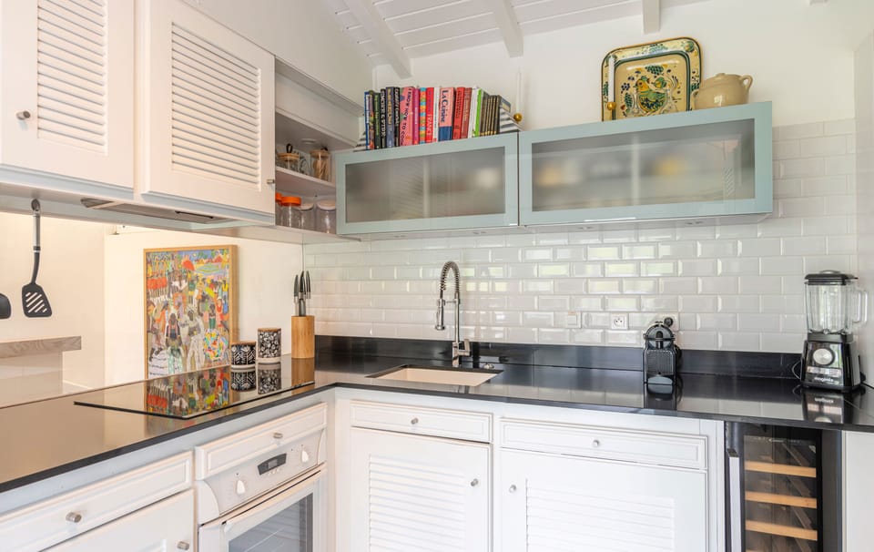 Fully equipped air-conditioned kitchen with electric oven, induction cooker, microwave, fridge and freezer, dishwasher, toaster, coffee maker, blender, electric kettle. Outdoor dining room with a rectangular wooden table for 8 people. Gas barbecue on the 
