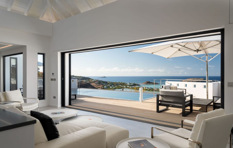 Air conditioning, HD-TV, Dish Network. The living room opens onto the terrace and the views. 