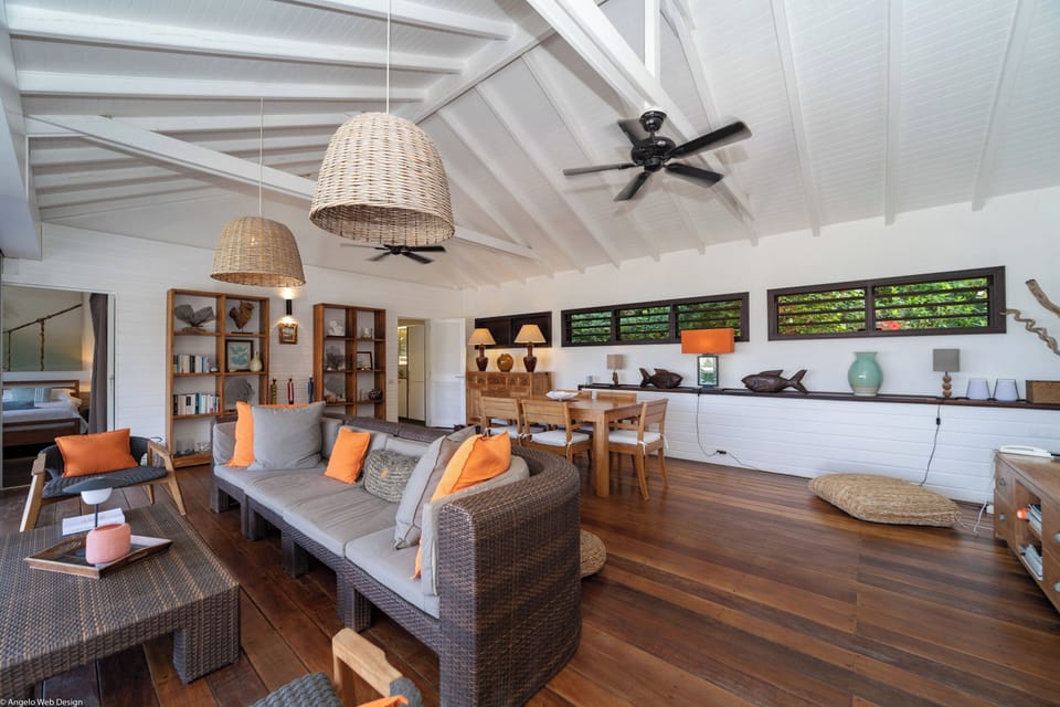Lounge area in the great room, ceiling fan. 