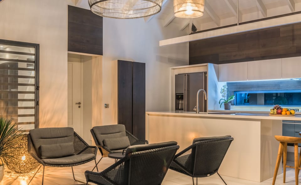 Great room with ceiling fan, HD-TV, Dish Network. The living room opens onto the terrace and the views. 
