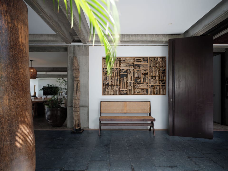Lounge area on the covered terrace facing the panoramic views. 