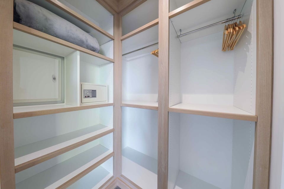King size bed, air conditioning, safe, dressing room. Adjoining bathroom with rain shower and regular shower head, two sinks, hair dryer, towels and beach towels. 