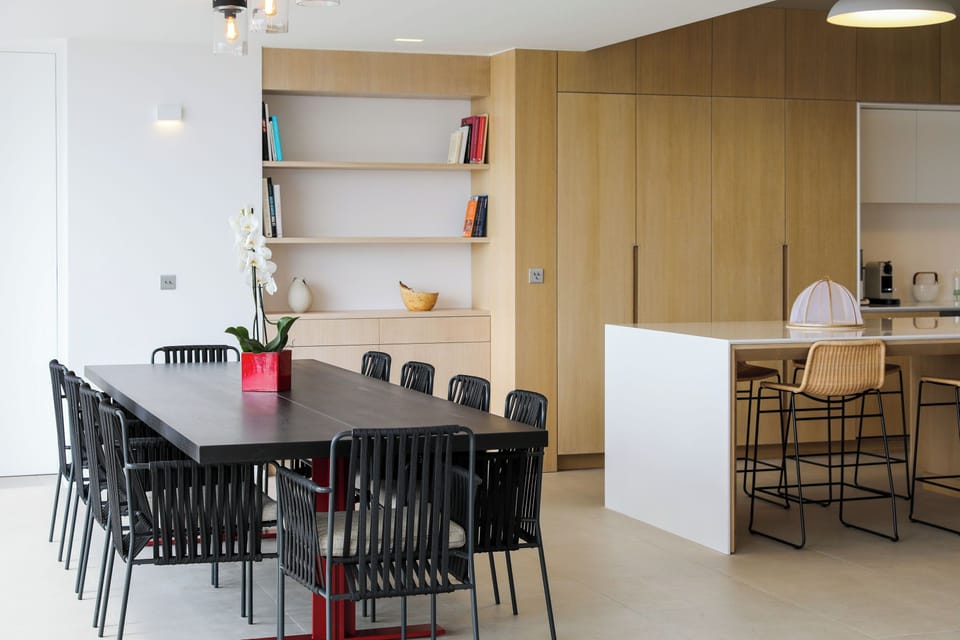 Indoor dining table for eight guests. Ocean view. 