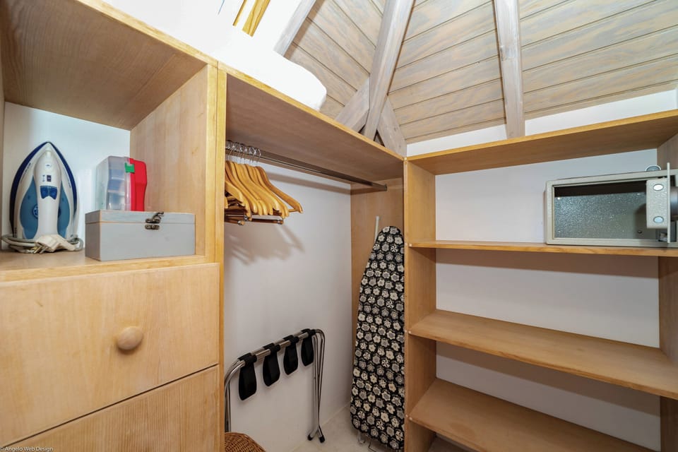 King size bed, air conditioning, ceiling fan, HD-TV, Dish Network. Bathroom with shower, hair dryer, bathrobes, towels and beach towels. 