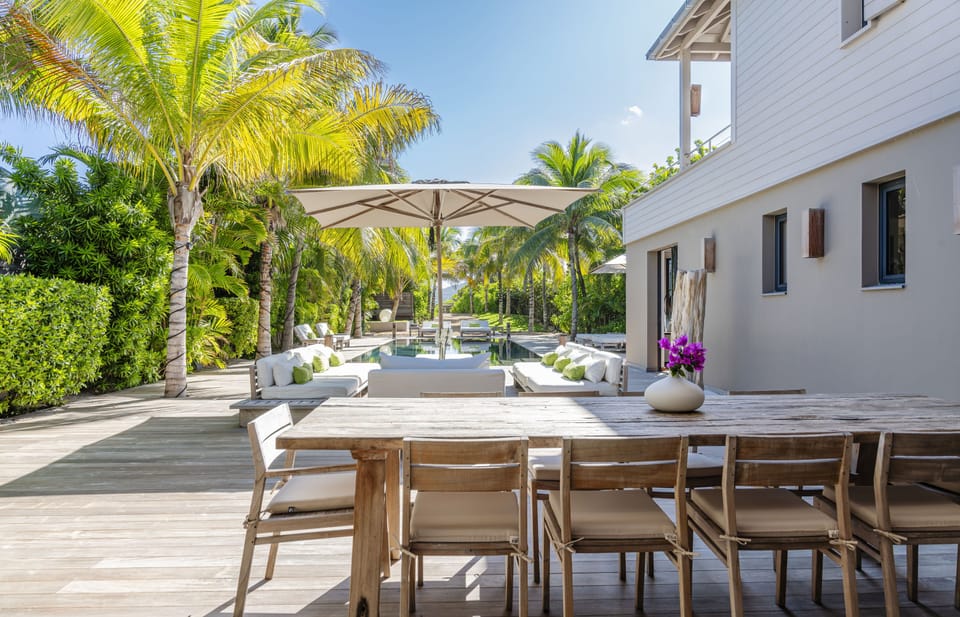 Nice outdoor wooden table on the sunny terrace. 