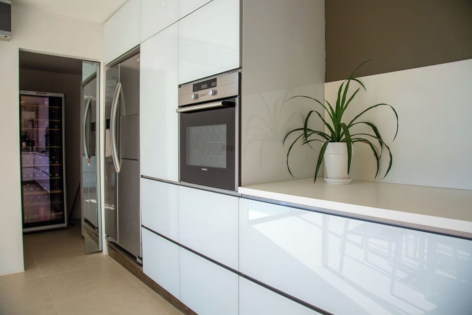 Air-conditioned, fully equipped kitchen. Oven, microwave oven, mixer, blender, refrigerator, freezer, ice machine, dishwasher, citrus press, Nespresso coffee machine, kettle, toaster. Wine cellar. Dining table with four chairs.