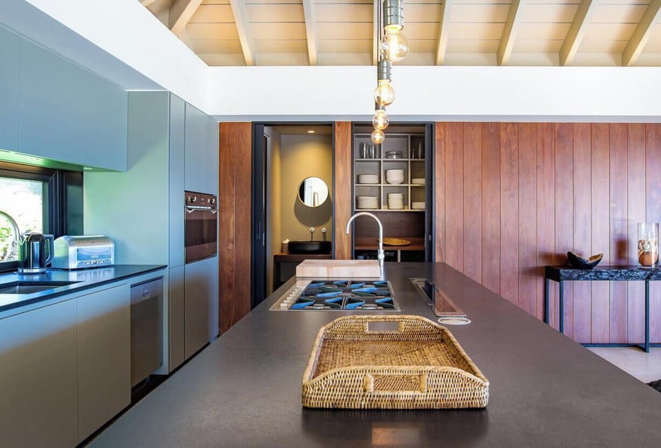 Fully equipped gourmet air-conditioned kitchen with electric oven, gas stove, convection oven, microwave, hood, two refrigerators/freezers with ice makers, dishwasher, blender, Nespresso coffee maker, toaster, bar counter. Gas barbecue and plancha outside