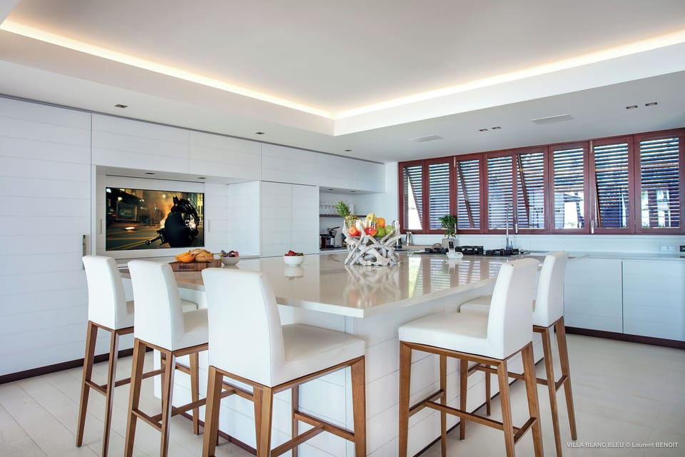 Air-conditioned. Spacious gourmet kitchen, gas oven and stove, microwave, fridge/freezer with ice machine, extra fridge and freezer, two dishwashers, retractable hood, wine cellar, juicer, two electric kettles, coffee & Nespresso machines, toaster, mixer,