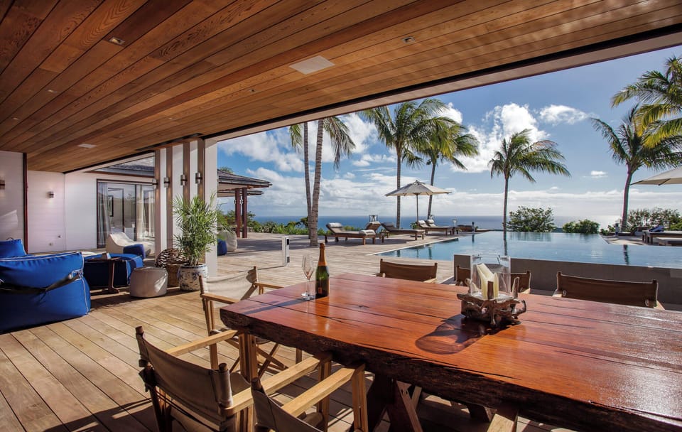 Air-conditioned. Spacious gourmet kitchen, gas oven and stove, microwave, fridge/freezer with ice machine, extra fridge and freezer, two dishwashers, retractable hood, wine cellar, juicer, two electric kettles, coffee & Nespresso machines, toaster, mixer,